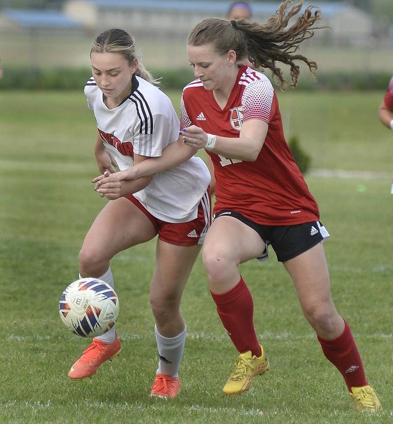 Streator’s Anna Russow gets by Metamora’s Lucy Micschler during the Class 2A Regional championship on Thursday, May 19, 2023 in Streator.