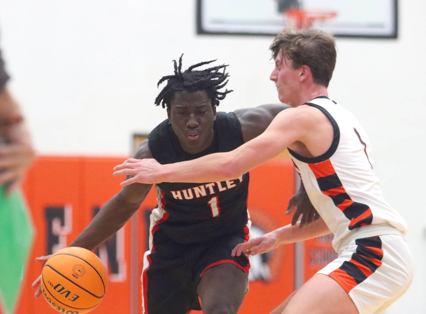 McHenry’s Dylan Hurckes, right, guards  Huntley’s Sheldon Bonsu in varsity boys basketball on Wednesday, Jan. 15, 2025, at McHenry High School in McHenry.