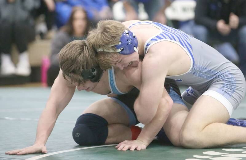 Marquette's Reily Leifheit wrestles Princeton's Casey Etheridge in the 165 pound weight class during the Class 1A Regional meet on Saturday, Feb. 8, 2025 at St. Bede Academy.
