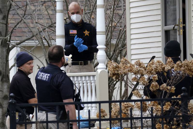 Police investigate at the residence of 408 La Fox River Drive on Wednesday, Dec. 1, 2021, in Algonquin. The bodies of a man and a woman were found about noon Wednesday after a well-being check on La Fox River Drive the day before, according to Algonquin police.