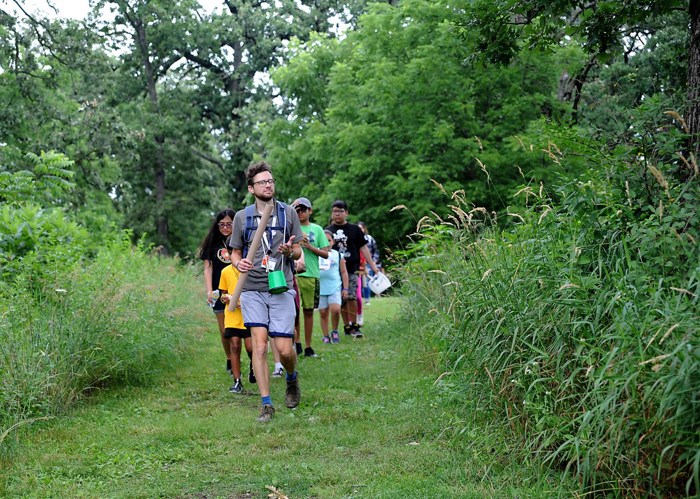 Nate Szkil, an education program coordinator with McHenry County Conservation District, leads children from Youth and Family Center of McHenry County’s summer camp program on a rhythm in nature hike during a field trip to the Harrison Benwell Conservation Area, 7055 McCullom Lake Road in Wonder Lake. The Youth and Family Center of McHenry County is hiring a social worker to assist with the mental health needs of those they help. The nonprofit is one of three receiving funds through United Way of Greater McHenry County as part of an Advance McHenry County grant.