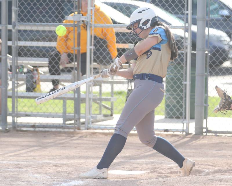 Marquette's Makayla Backos gets a hit against Putnam County on Tuesday, April 29, 2025 in Ottawa.