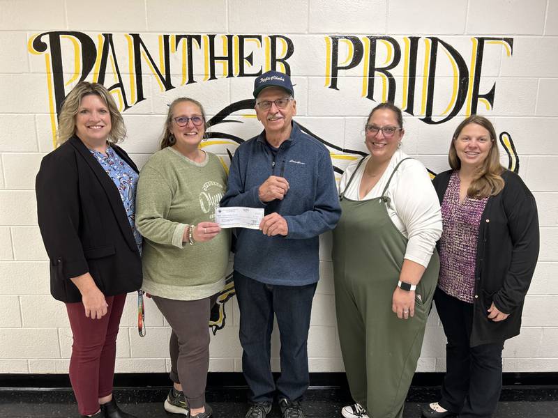 (From left) Jodi Peterson, director of Student Services; Wendy Lewis, special education teacher/ITP/Special Olympics coach; Doug Ossola, Granville Knights of Columbus Tootsie Roll co-chairman; Jackie Gerling, special education teacher; and Jodie Goetz, special education teacher come together for the Granville Knights of Columbus donation to Putnam County schools' program.