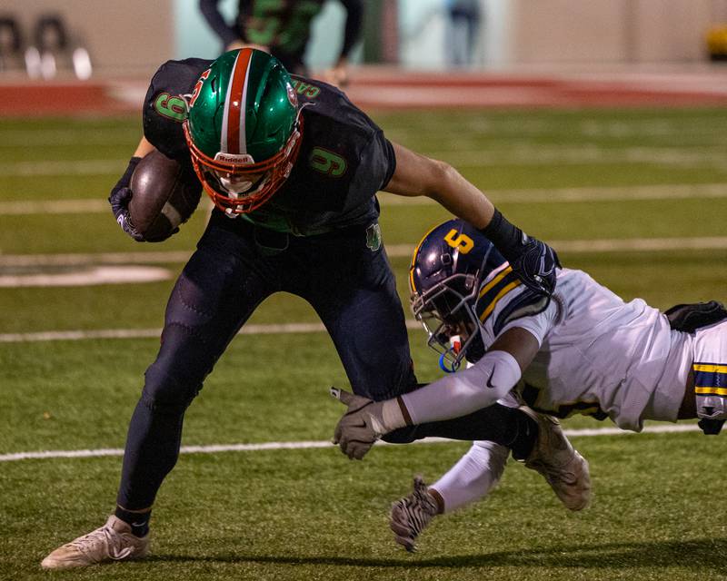 Jaron Morscheiser (9) of L-P runs ball as Christopher Little (6) of O' Fallon attempts to bring him down on Friday, October 24, 2025 at Howard Fellows Stadium in LaSalle.