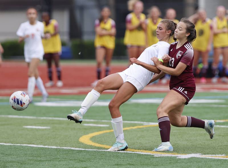 Crystal Lake Central's Hadley Ferrero (4) fights for the ball against St. Ignatius' Lill Garcia (13) during the 2A girl's varsity supersectional soccer match between Crystal Lake South and St. Ignatius high schools on Tuesday, June 3, 2025 in Chicago.