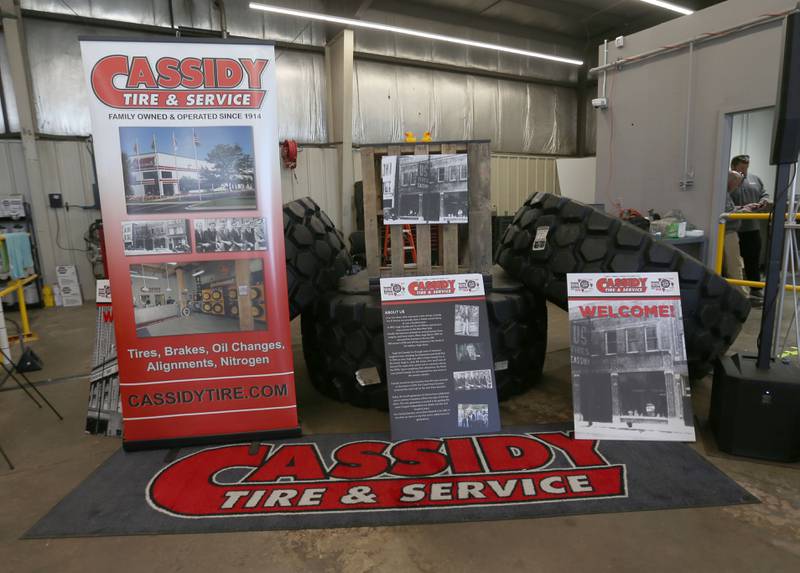 A display showing the history of Cassidy Tire  welcomes visitors to their open house on Saturday April 26, 2025 in Peru. The new location is located at 1414 38th Street in Peru. The event had giveaways, food truck and much more.