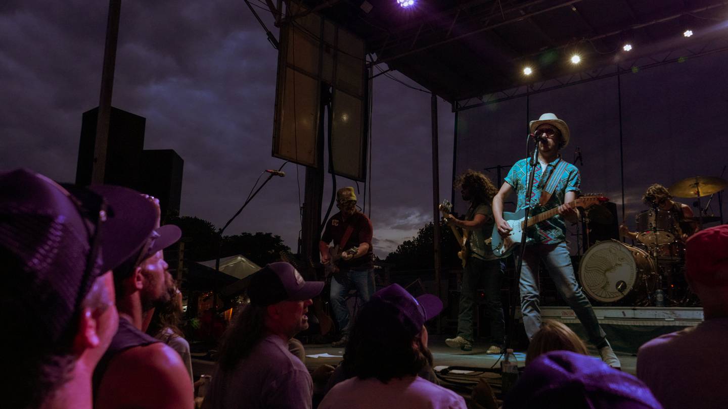 Singer/Songwriter Mike Harmeier of the Texan-band Silverada serenades the crowd at Yorkville's Summer Solstice Indie Music Festival
