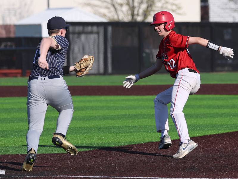 Hiawatha's Mason Alm has South Beloit's Macen Peot in a rundown after he was picked off Thursday, April 16, 2026, during their game at Northern Illinois University in DeKalb.