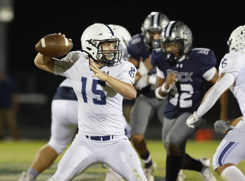 Plainfield South's Cody Hogan (15) gets set to pass during the varsity football game between Plainfield South and Oswego East on Friday, Sep. 20, 2024 in Oswego.