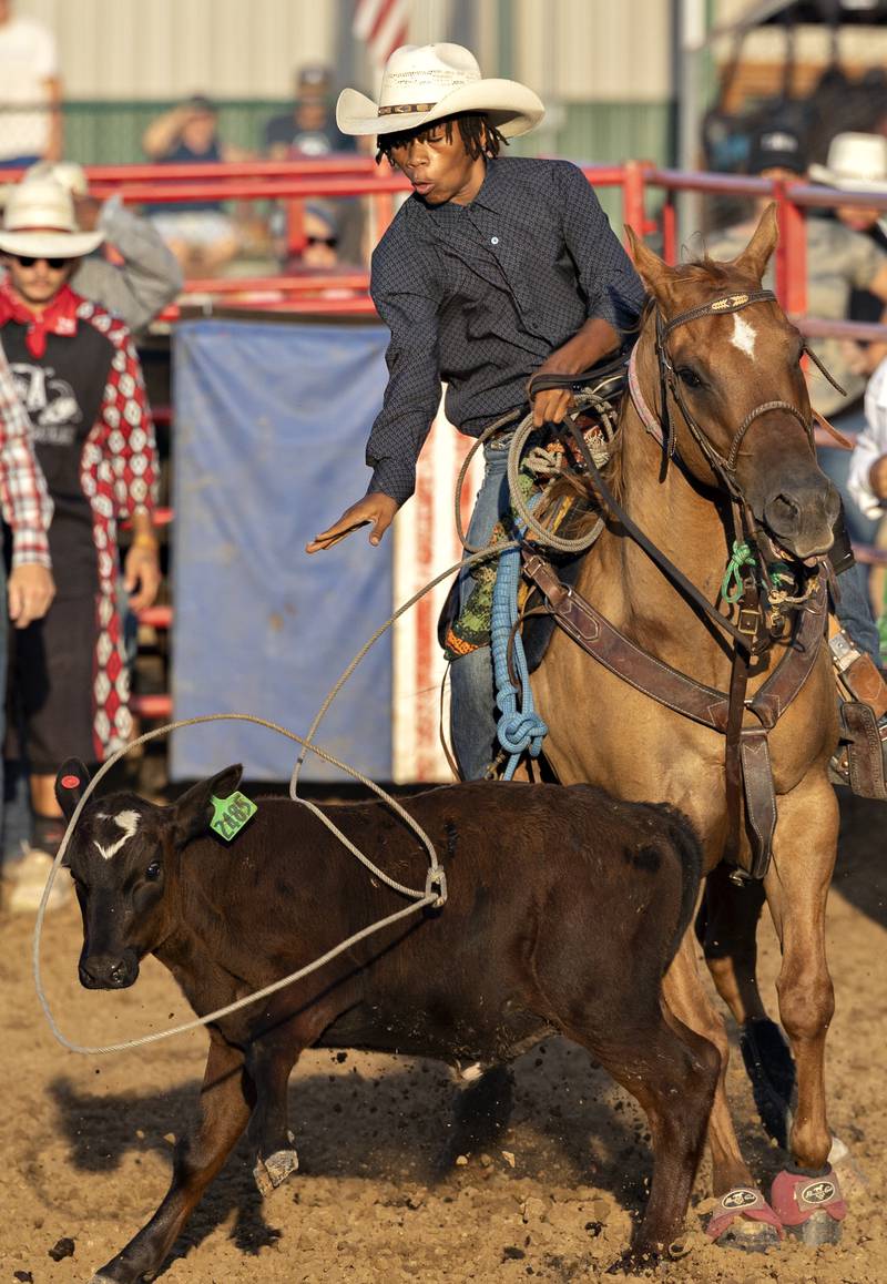 Colyer Bland throws a lasso in the calf roping event Thursday, August 7, 2025, at Carroll County Fair’s T and A Bucking Bulls Rodeo.