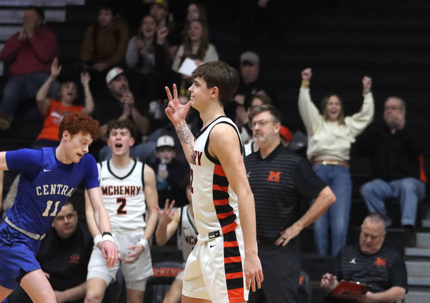 McHenry’s Caleb Jett celebrates a three-point basket to put the Warriors ahead for good in the OT period against Burlington Central in varsity boys basketball on Tuesday, Feb. 4, 2025, at  McHenry High School  in McHenry.