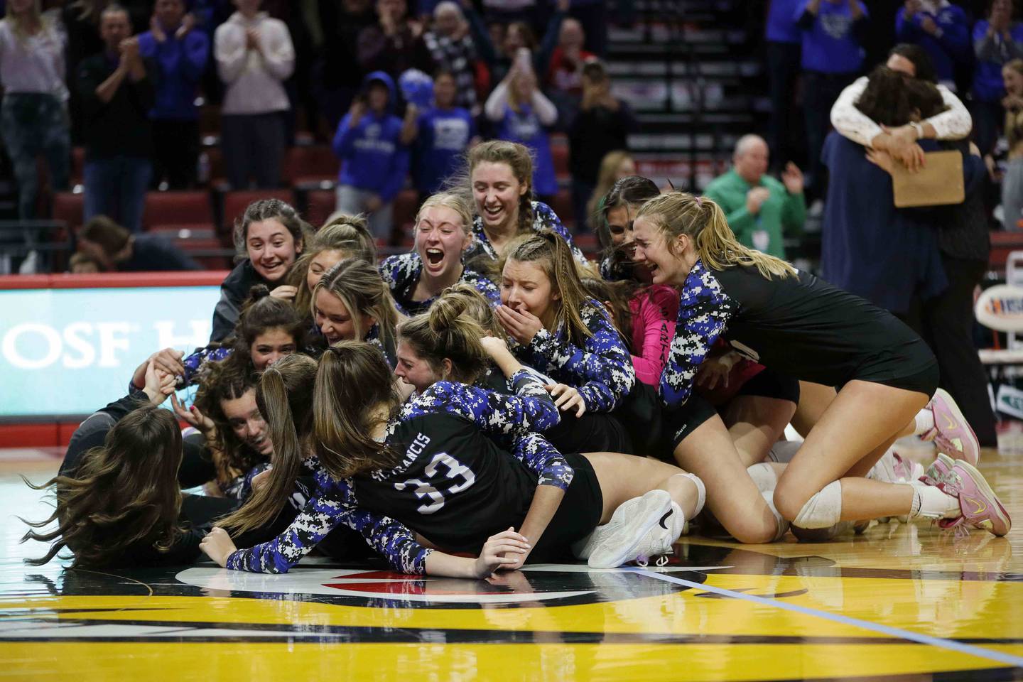 St. Francis celebrates after their win in the IHSA Class 3A girls volleyball state championship game between St. Francis and Nazareth Academy Saturday November 12, 2022 at Redbird Arena in Normal.