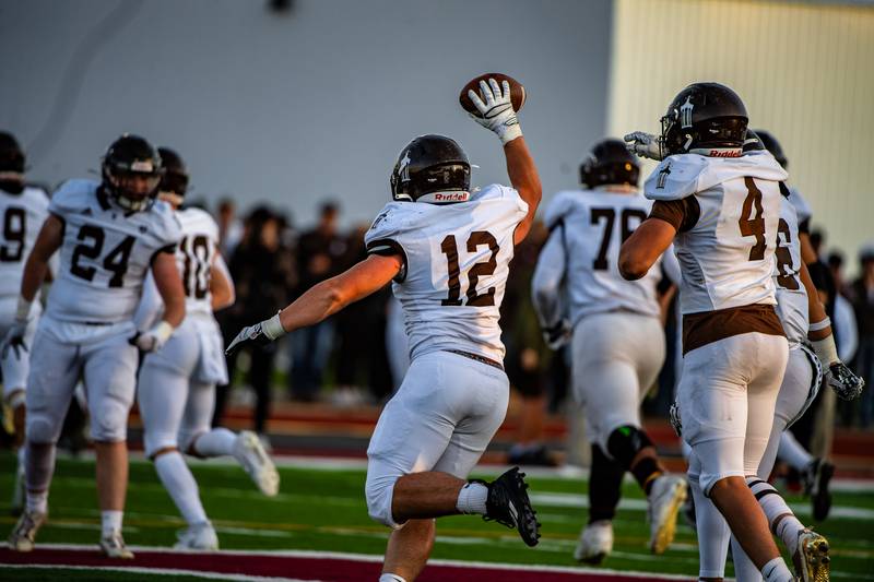 Joliet Catholic Academy's Zach Pomatto celebrates recovering a Morris fumble during the 5A Quarterfinals game on Saturday Nov. 11, 2023 at Morris High School