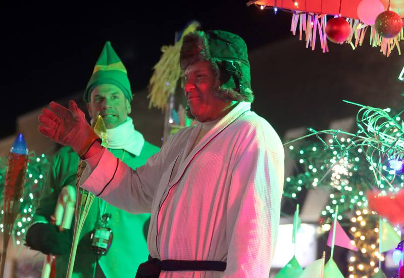 Characters greet parade goers during the Festival of Lights Holiday Parade in downtown Crystal Lake on Friday, Nov. 29, 2024.