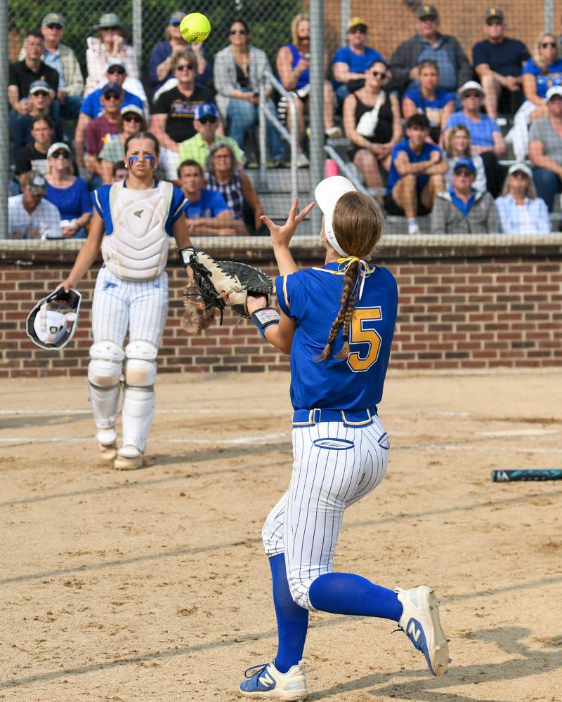 Wheaton North's Emma Dodge (5) catches the ball for an out during the sectional semifinal game while taking on Weaton Warrenville South on Thursday June 5, 2025, held at Oswego High School.
