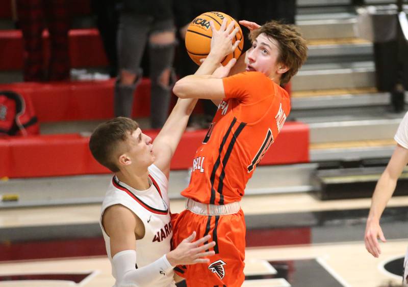Flanagan-Cornell's Seth Jones runs in the lane as he is met by Woodland's Noah Decker during the Route 17 Classic Tournament on Wednesday, Nov. 27, 2024 at Woodland High School.