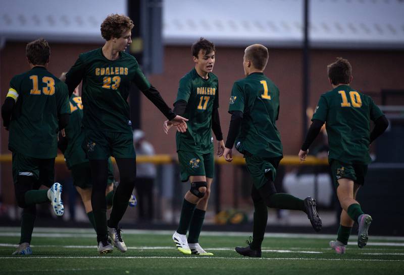 Coal City's Adrian Dames, center, is congratulated on a goal in the first half of a sectional game against Herscher on Tuesday, October 28, 2025.