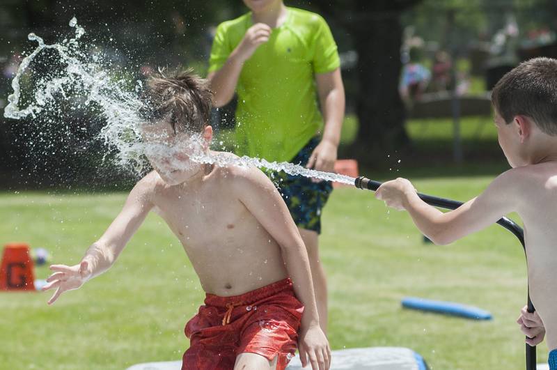 Barrett Weigle, 9, gets blasted in the face by Easton Faivre, 9, Wednesday, June 15, 2022 at Dixon Park District’s SPARK Camp.