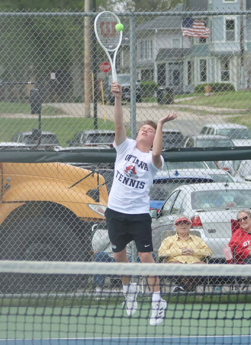 Ottawa's Gabe Zeglis serves the ball on Tuesday, April 21, 2026 in the Henderson-Guenther Tennis Facility at Ottawa High School.