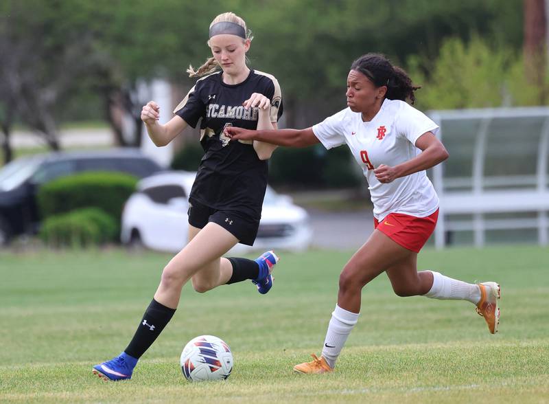 Sycamore's Avery Olson and Rock Island's Aubrey Doss go after the ball Friday, May 22, 2026, during their Class 2A regional championship matchup at Sycamore High School.