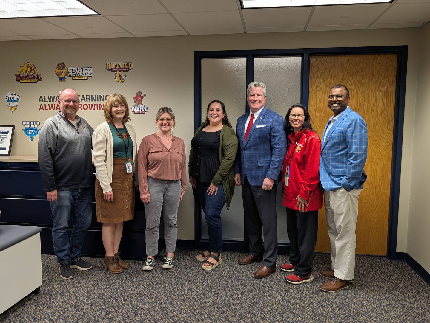 The new Batavia School District board gathers after welcoming two new board members. From left to right, Craig Meadows, Kristin Gehrels, Katy Swiecicki, Danielle Sligar, Aaron Kilburg, Raquel Gonzalez-Thomas, and Rob Arulandu.
