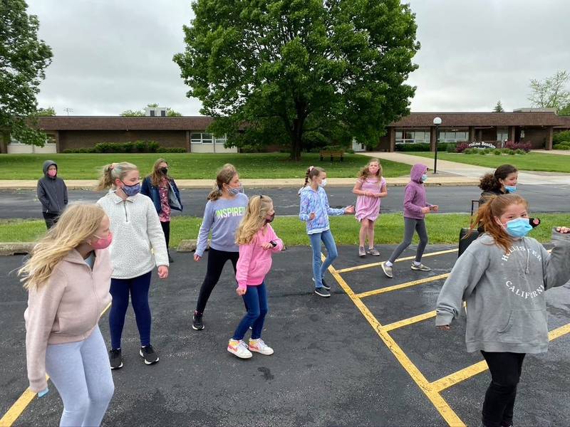 A photo from June 1 posted on the Facebook page for the New Lenox School District 122 shows students outside in facemasks. Some parents have expressed concerns about students wearing facemasks when they return to in-person learning in the fall.