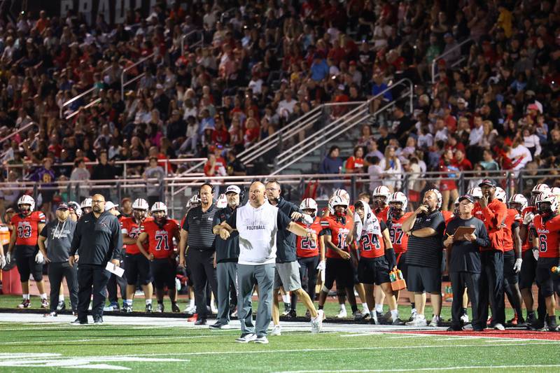 Bradley-Bourbonnais head coach Mike Kohl communicates to his players during the Boilermakers' 35-6 victory over Waubonsie Valley Friday, Sept. 12, 2025.