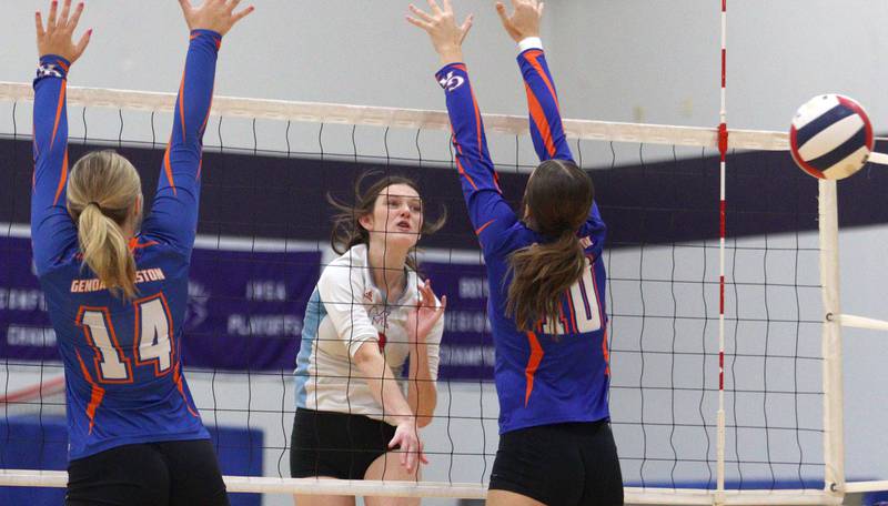 Marian Central’s Mary Kate Hernon sends the ball over the net against Genoa-Kingston in varsity volleyball tournament action on Saturday, Sept. 21, 2024, at Hampshire High School in Hampshire.