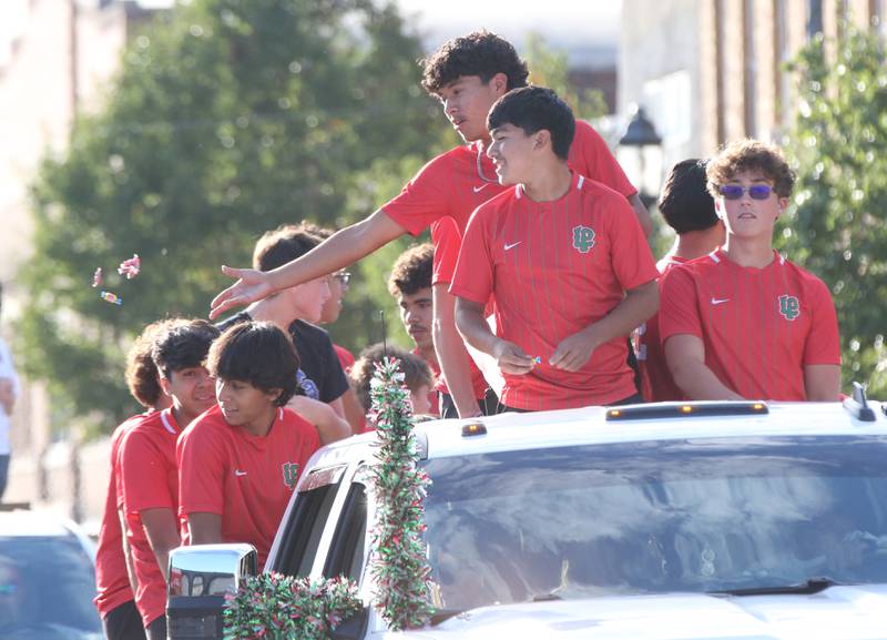 Members of the L-P boys soccer team ride during the L-P Homecoming parade on Thursday, Oct. 5, 2023 downtown La Salle.