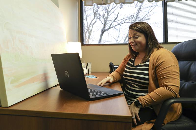 Therapist Meaghan Dugan of Trinity Counseling prepares to speak with a patient on Thursday, Jan. 14, 2021, at Trinity Services Inc. in Joliet, Ill. Due to quarantines and lock downs, telehealth and online therapy has become a vital service for individuals during their time of need. Trinity Services Inc. is one of the community partners of the United Way of Will County.
