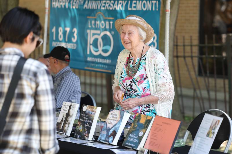 Author Pat Camalliere, a Lemont native, promotes her fictional books that takes place in and around Lemont at the Lemont 150th Anniversary Commemoration on Friday, June 9, 2023 in downtown Lemont.