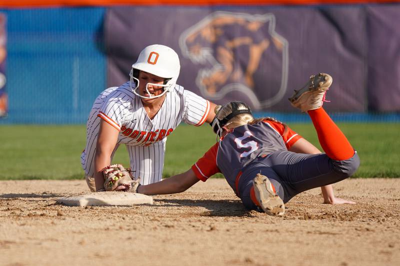 Oswego’s Kiyah Chavez (10) beats the tag at second after hitting a two run double during a Southwest Prairie Conference softball game against Minooka at Oswego High School on Wednesday, April 23, 2025.