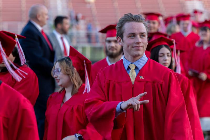 Ethan Farr signals hand towards crowd on Friday May 23, 2025 at Ottawa High School in Ottawa.