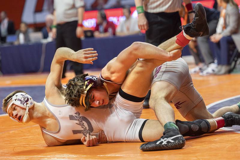 Richmond-Burton’s Emmett Nelson is controlled by Unity Christian’s Kaden Inman in the 144 pound weight class of the 1A state individual wrestling finals Saturday, Feb. 22, 2025, at State Farm Center in Champaign.