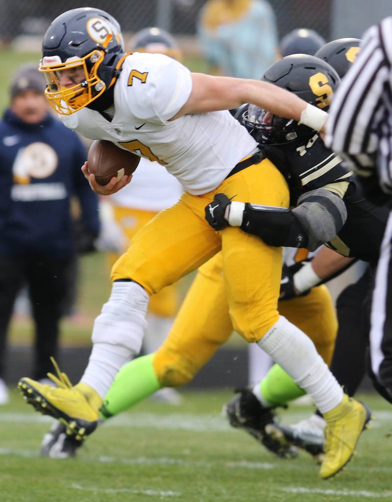 Sterling's Kael Ryan tries to pull away from Sycamore's Zack Crawford during their Class 5A state playoff game Saturday, Nov. 12, 2022, at Sycamore High School.