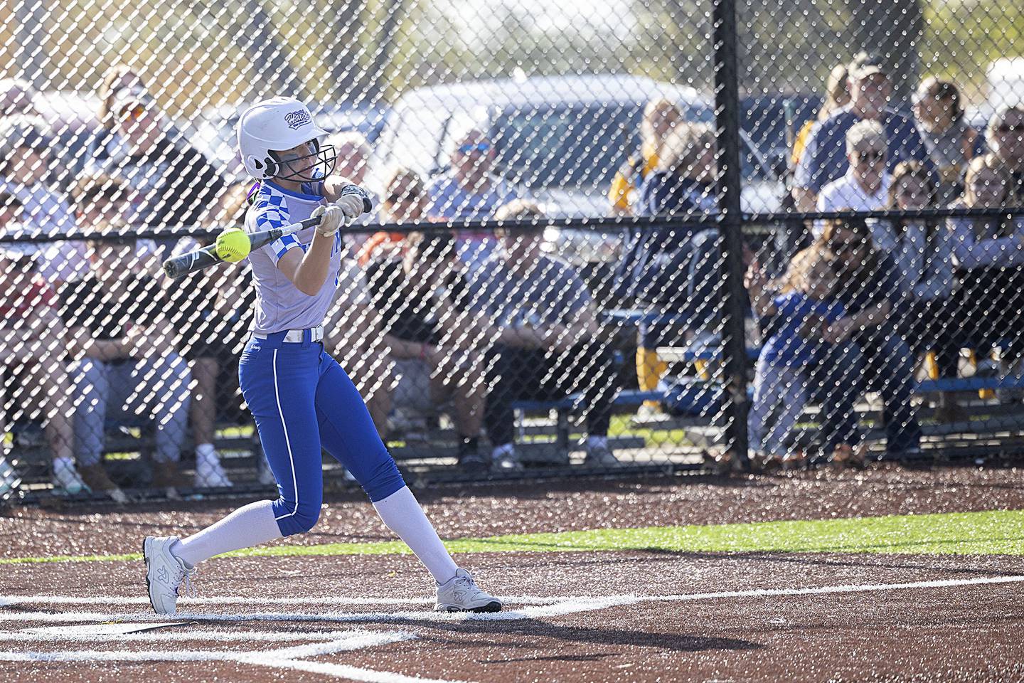 Newman’s Madison Duhon drives the ball to right for a single against Sterling Thursday, April 27, 2023.