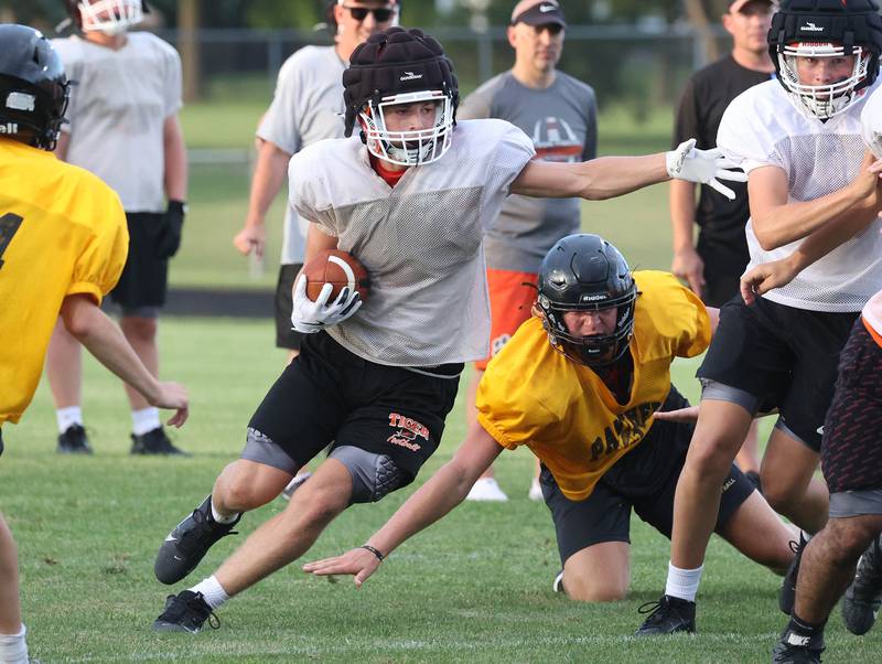 Lena-Winslow and Byron scrimmage Thursday, July 24, 2025, during a joint practice with Byron, Lena-Winslow and Sycamore at Sycamore High School.