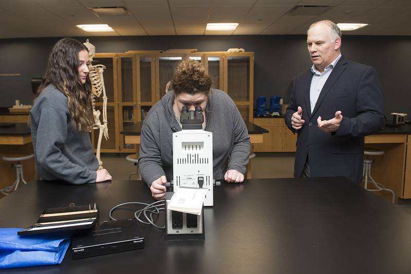 Adjunct biology professor James Sanders leads a lab with students Amanda Myer (left) and Ashley Earl Wednesday, March 23, 2022 at Sauk Valley College. After leaving a career in the Navy in 1994, Sanders attended chiropractic school which lead to his role as an educator.