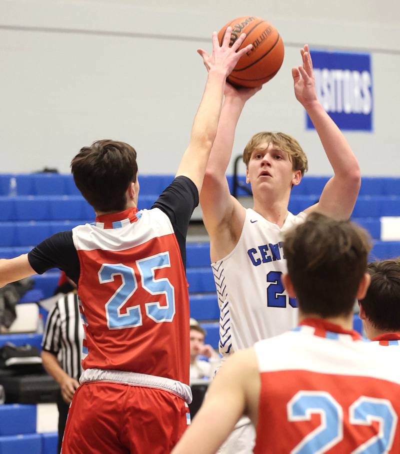 Burlington Central's Jacob Johnson shoots over Marian Central's Colin Kowalsky Monday, Jan. 15, 2023, during their game in the Burlington Central Martin Luther King Jr. boys basketball tournament.