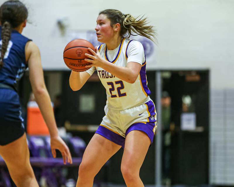 Downers Grove North's Lilly Boor (22) looks to pass during girls basketball game between Downers Grove South at Downers Grove North. Dec 16, 2023.