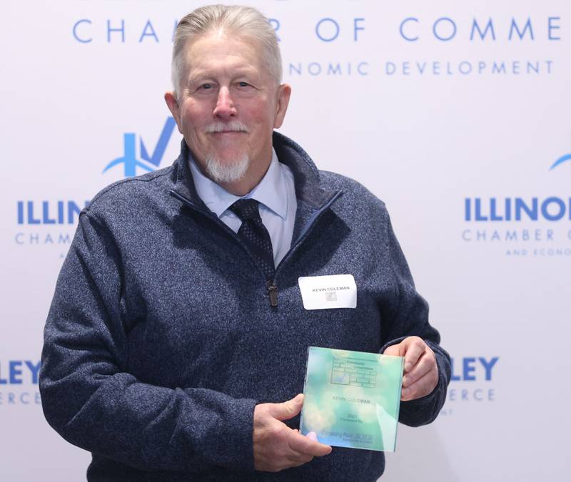 Kevin Coleman poses with his Cornerstone award during the Illinois Valley Chamber of Champions of Change Awards Night on Wednesday, May 6, 2026 at the Westclox Event Center in Peru.