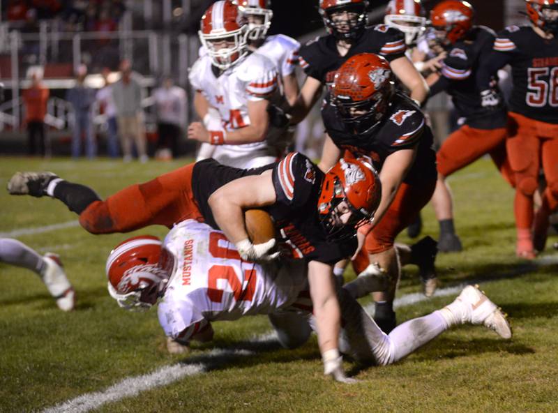Fulton's Skylier Crooks (33) is upended by Morrison's Brady Anderson (20) on Friday, Oct. 25, 2024 in Fulton.