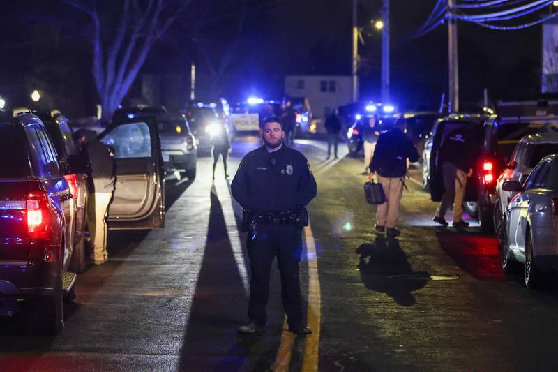 Law enforcement officers are seen outside a storage facility where a suspect in the shooting at Brown University was found dead, Thursday, Dec. 18, 2025, in Salem, N.H. (AP Photo/Reba Saldanha)