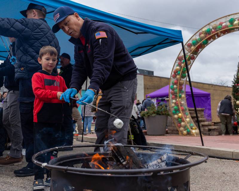 (from left) Jaxon Kent and Jaime Murillo toast Marshmello on fire at Frosty on First on Saturday, November 8, 2025 on First Street in La Salle.