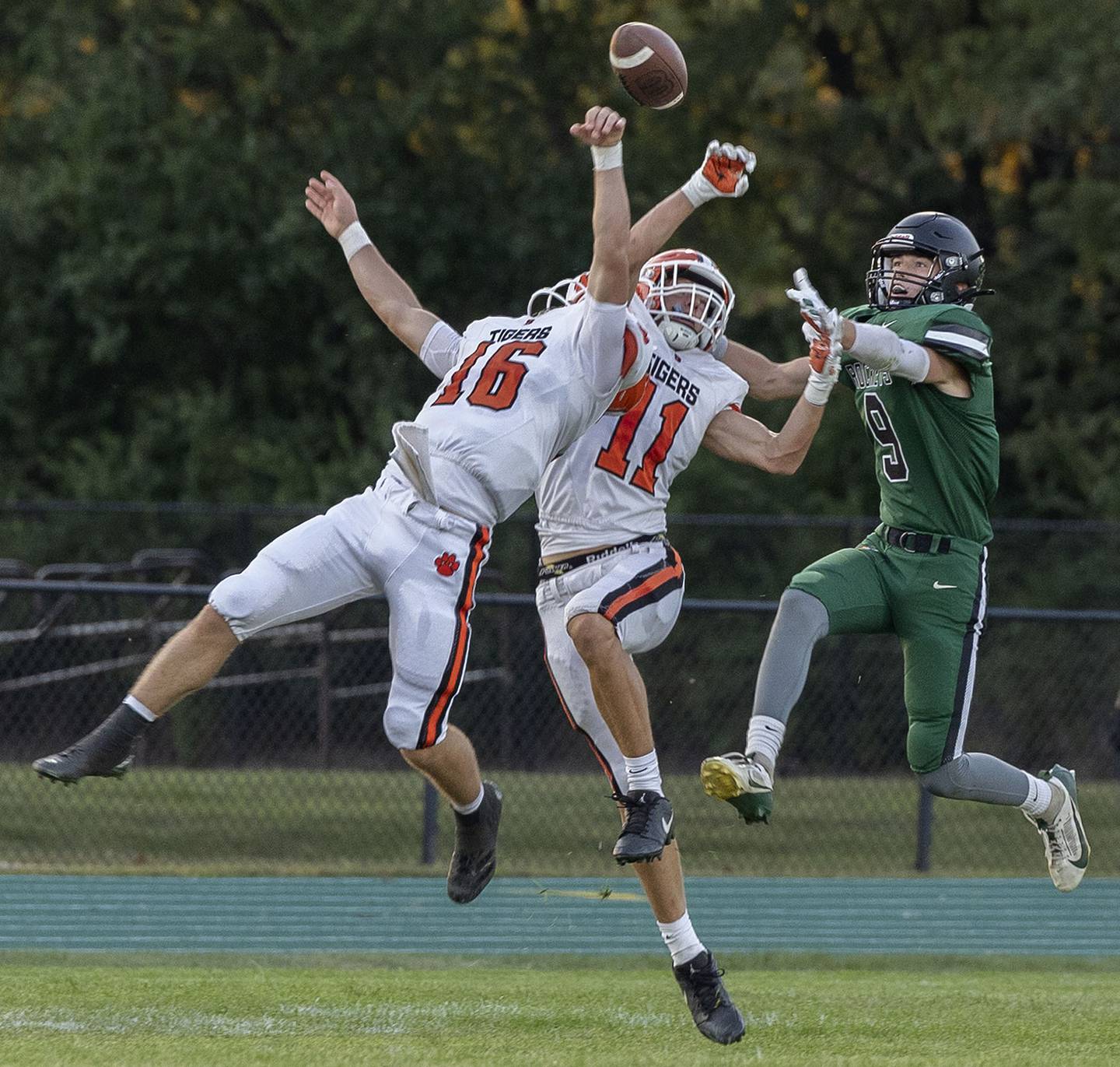 Byron’s Andrew Talbert (left) and Weston Auker breaks up a pass intended for Rock Falls’ Connor Fritz against Byron Thursday, August 28, 2025.
