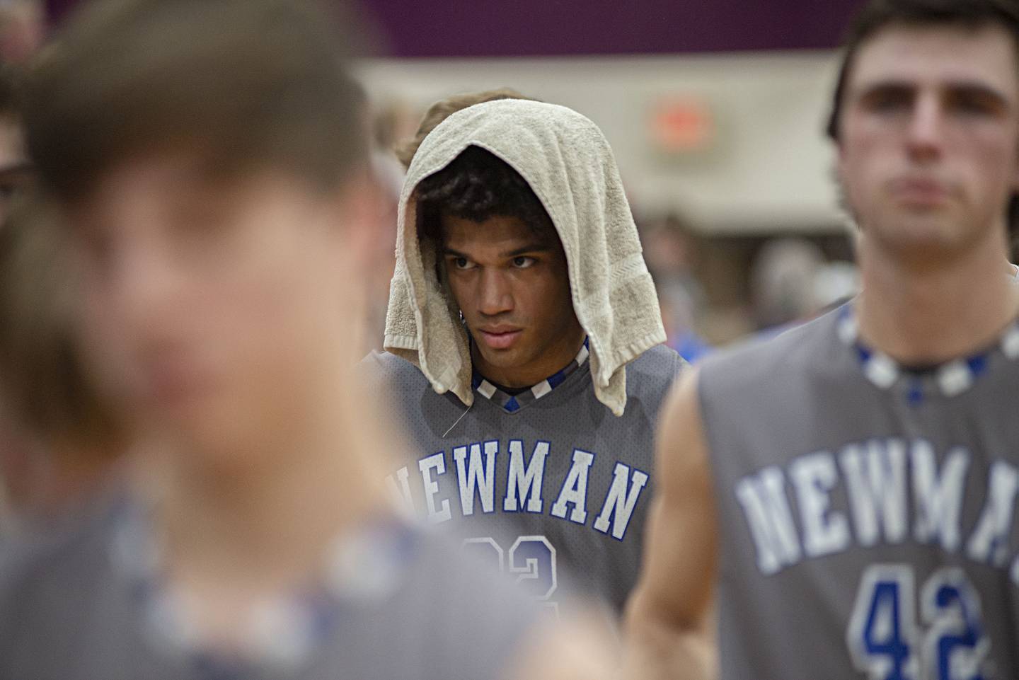 Newman's Marcus Williams walks off the court after the Comets fell to Scales Mound in the sectional final Friday, March 4, 2022.