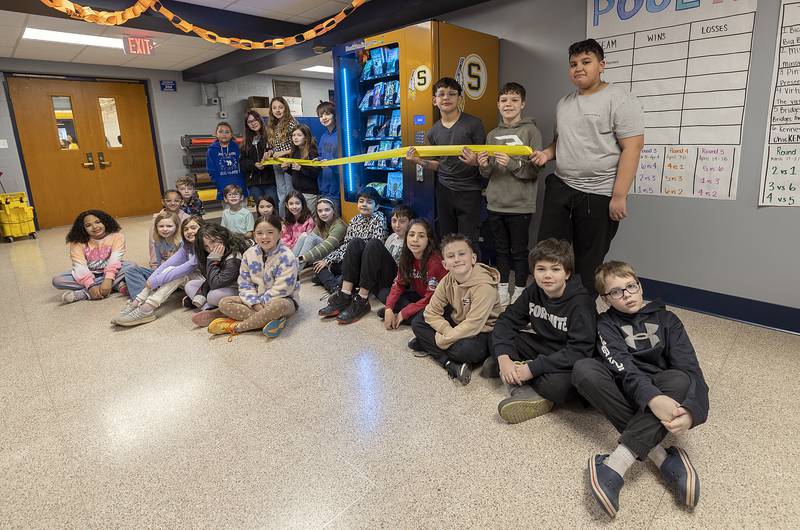 Exceptional readers at Lincoln School in Sterling were invited to cut the ribbon Tuesday, March 25, 2025, on a new book vending machine.