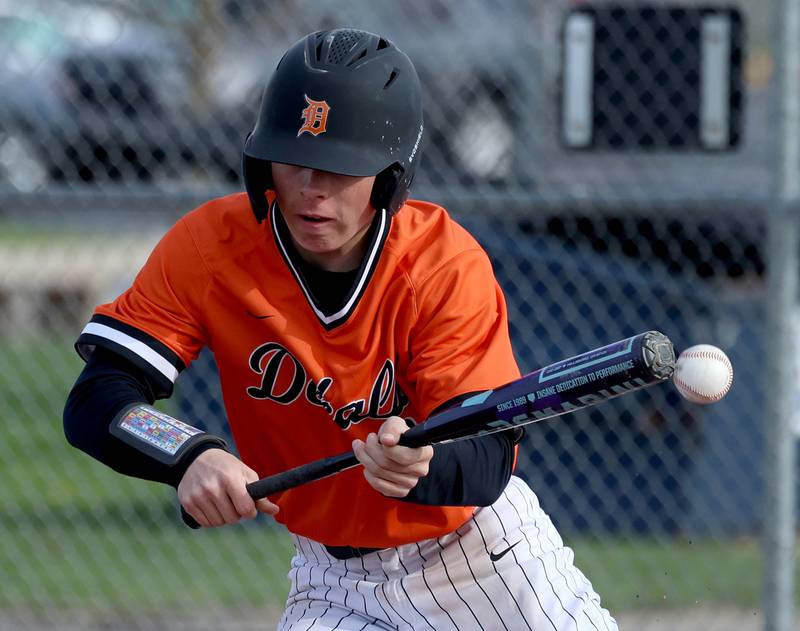DeKalb's Luke Duffy tries to get a bunt down Monday, April 20, 2026, during their game against Waubonsie Valley at DeKalb High School.