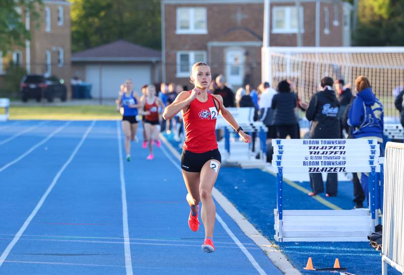 Lincoln-Way Central's Katie Petrosky nears the finish line in second place in the 800-meter race during the IHSA Class 3A Chicago Heights Girls Track and Field Sectional at Bloom High School on Wednesday, May 13, 2026.