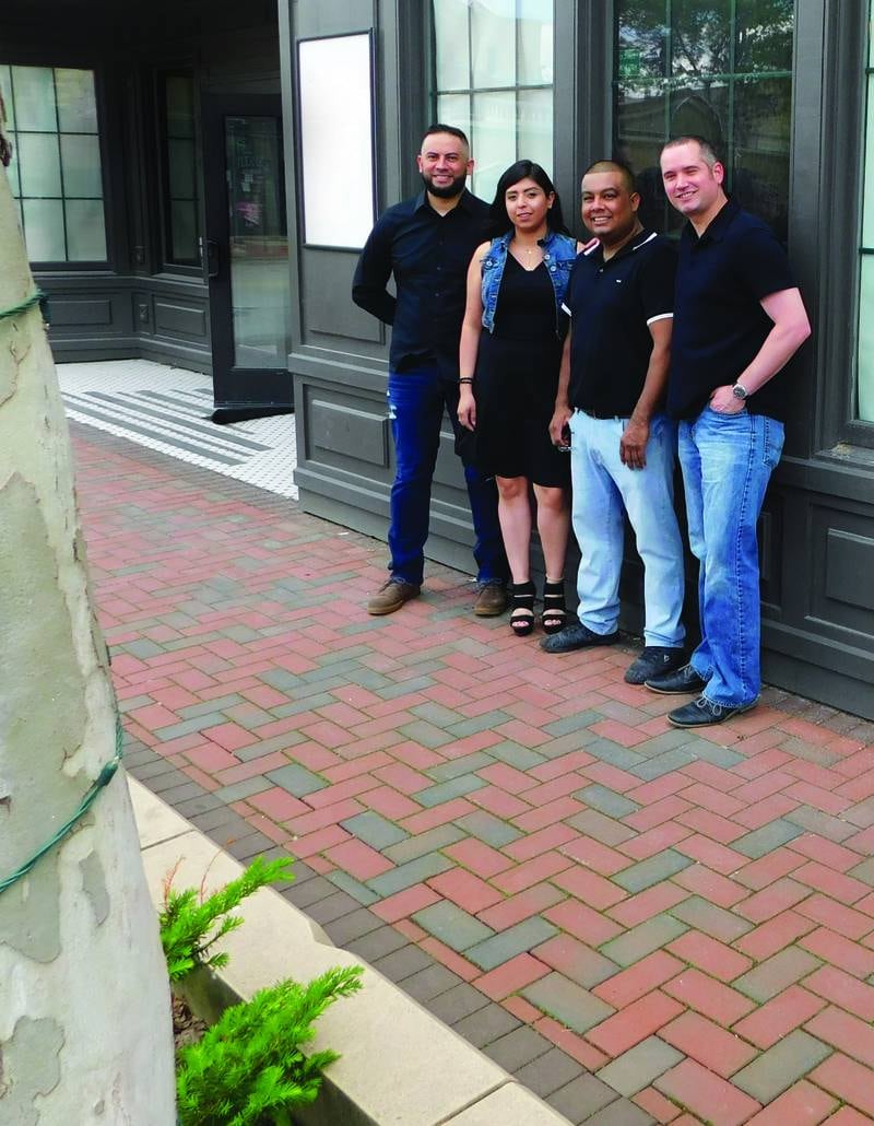 The co-owners of DeKalb's newest event venue, Cuatro Amigos.
